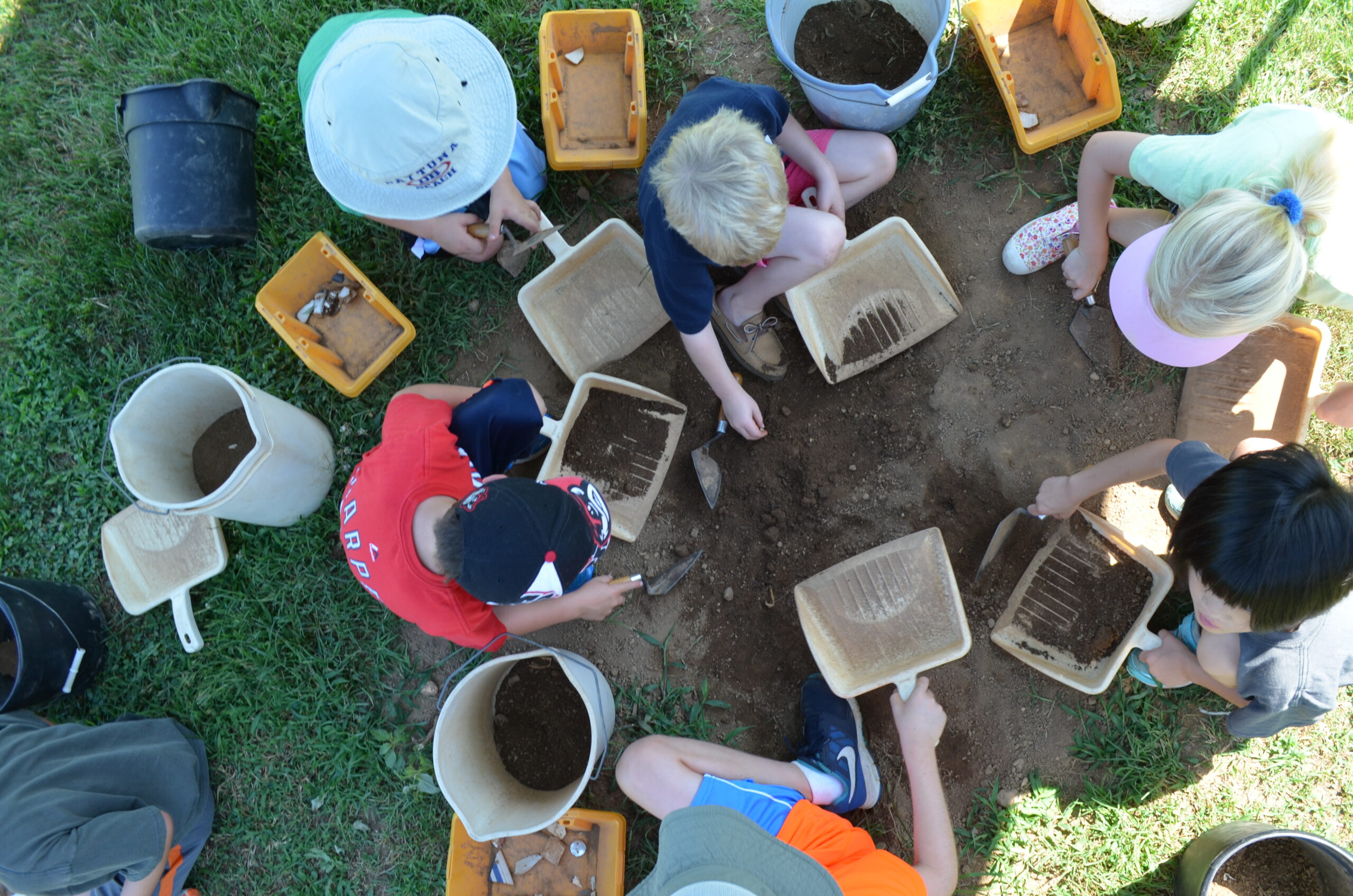 overhead view of volunteers sifting dirt at Ferry Farm