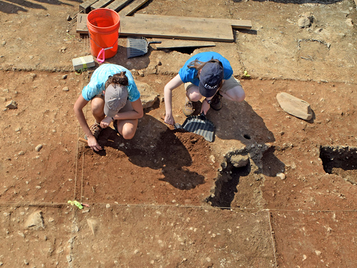 UMW students digging at an archaeology site at Ferry Farm