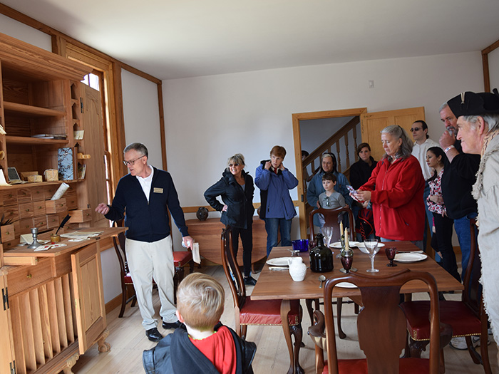 tour guide discussing items in the dining room of Ferry Farm